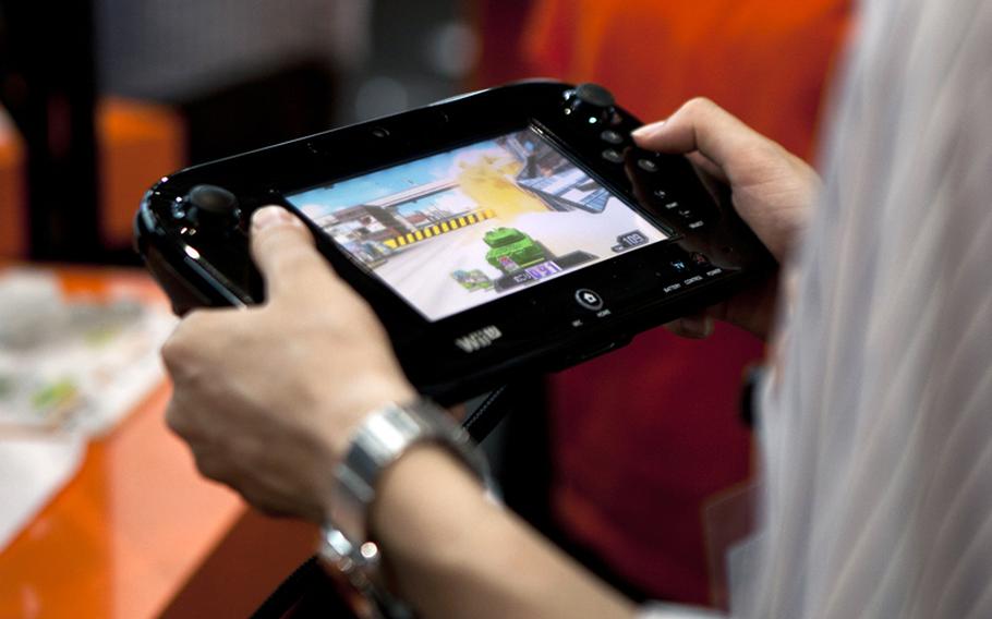 Gamers got the chance to try out a few games for the new Nintendo Wii U consolde, including "Tank! Tank! Tank!", which puts you behind the wheel of a tank against three other players.
