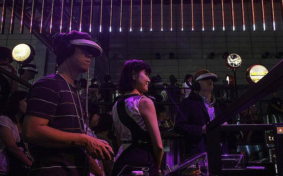 Attendee try out Sony's 3-D virtual reality headset, the Prototype-SR, at the 2012 Tokyo Game Show.