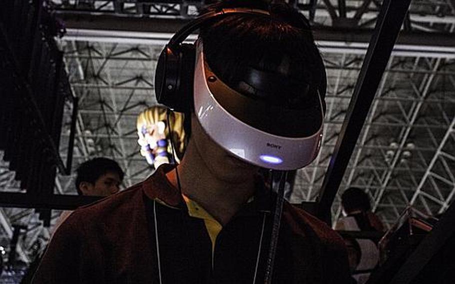 An attendee tries out Sony's 3-D virtual reality headset, the Prototype-SR at the 2012 Tokyo Game Show.