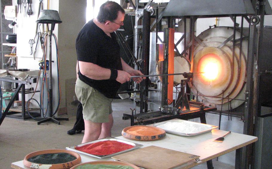 Glassblower par excellence Pascal Guernic keeps up a steady pace throughout the day, firing piece after piece of his fragile art at his workshop.