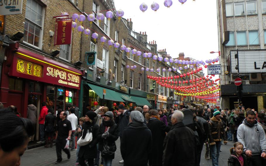 Chinese decorations hang above the streets of Chinatown in London as part of the Chinese New Year festival welcoming the Year of the Rabbit on Feb. 6.