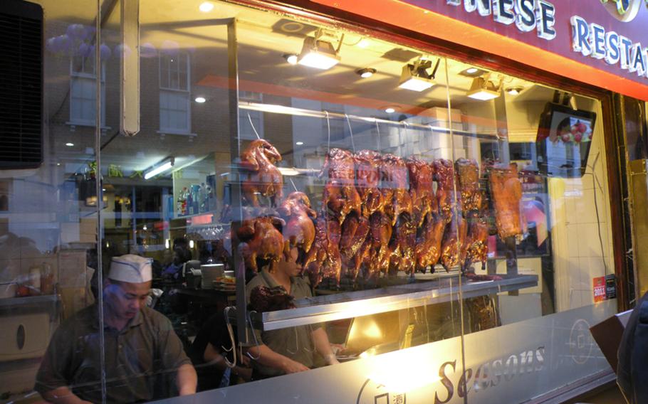 Tasty-looking crispy ducks available for purchase inside a restaurant on the streets in London's Chinatown. Thousands of people crowded the streets on Feb. 6 to celebrate the beginning of the Year of the Rabbit.
