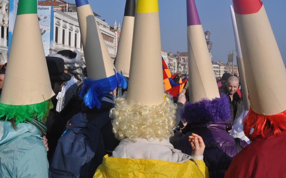 Got a group of friends willing to put on silly costumes and walk around a famous European city all day? Then Carnevale in Venice, Italy, is the place to be. This group dressed up as crayons, with each assuming a different color.