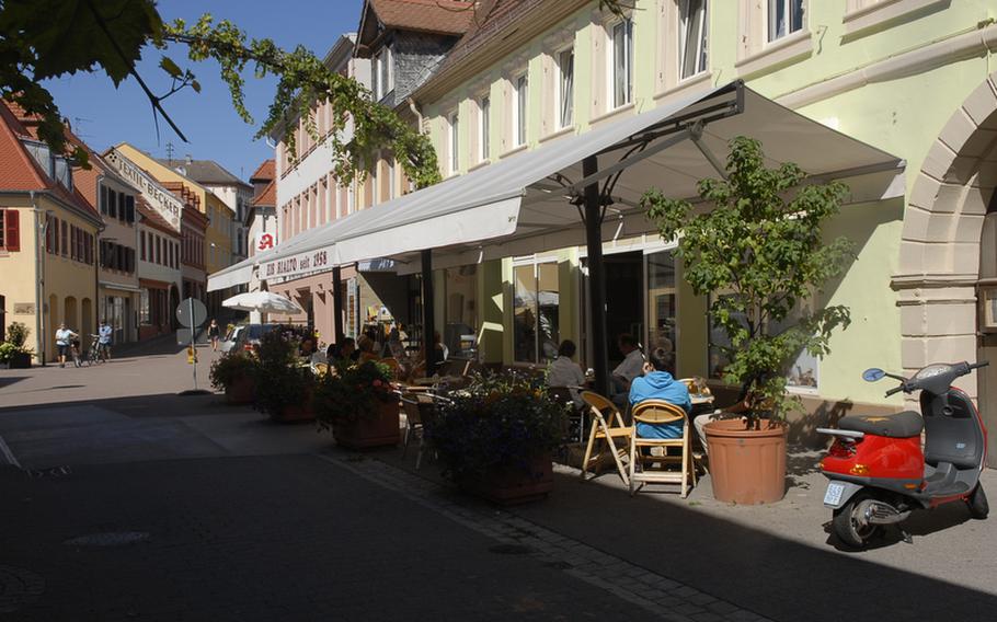 Several inviting outdoor cafes line the vine-decorated streets of Edenkoben, a village along Germany's southern wine route.
