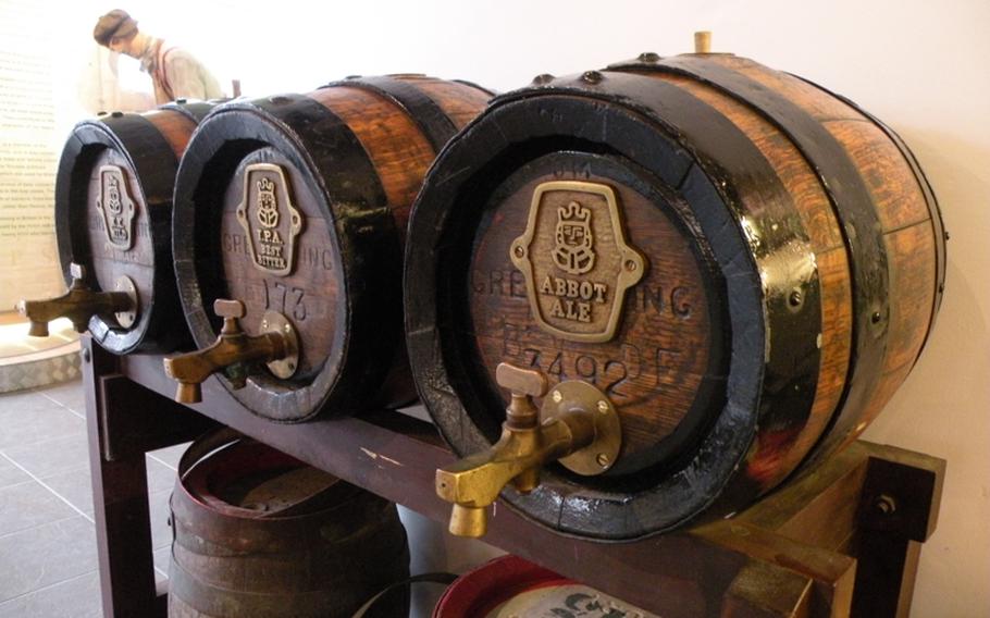 Three old casks are on display in the museum at the Greene King Brewing Co. in Bury St. Edmunds, England. A tour of the brewery shows the process and ingredients used in creating many of the company's ales.