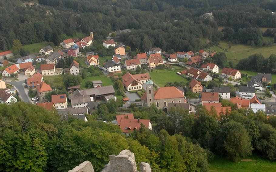 Burgruine Flossenbuerg, the ruins of a former castle, overlooks the town of Flossenbuerg and peer down into several granite quarries below. Former SS cabins (not pictured), where administrators for the town&#39;s former concentration camp lived, are also visible from the overlook.