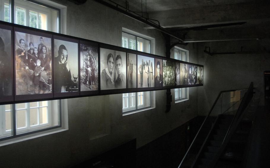 Photographs of former prisoners look over the permanent exhibit at KZ-Gedenkstaette Flossenbuerg, a memorial to the roughly 30,000 prisoners who died from execution or conditions within the former Nazi concentration camp at the site.