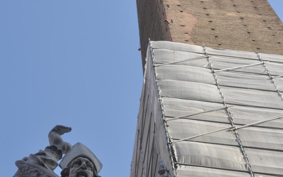 A statue of San Petronio, the patron saint of Bologna, stands under one of the two towers that make up the city's most famous landmark. It's possible to climb up the Torre degli Asinelli, even though some of the exterior is currently under restoration.