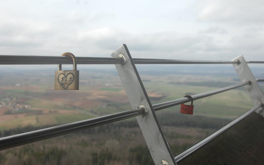 A pair of engraved padlocks hangs from the viewing platform railing at Rauher Kulm, a basalt dome in Germany's Upper Palatinate region and near the military community of Grafenwöhr.