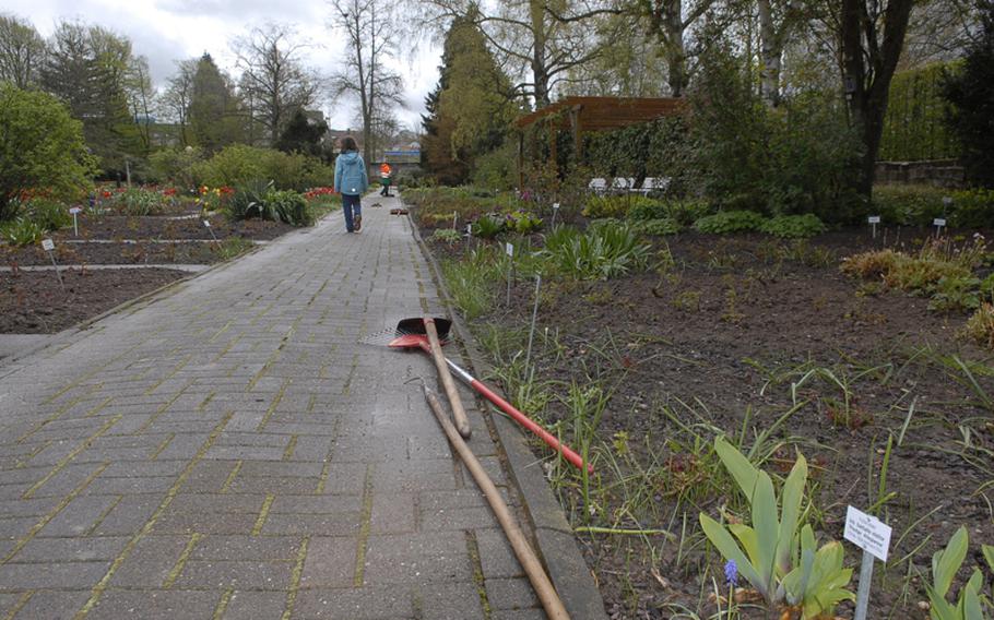 Gardeners' tools lie along a walkway at the Rose Garden in Zweibrücken, Germany. In April there was still much work to be done before the garden officially opened May 1.