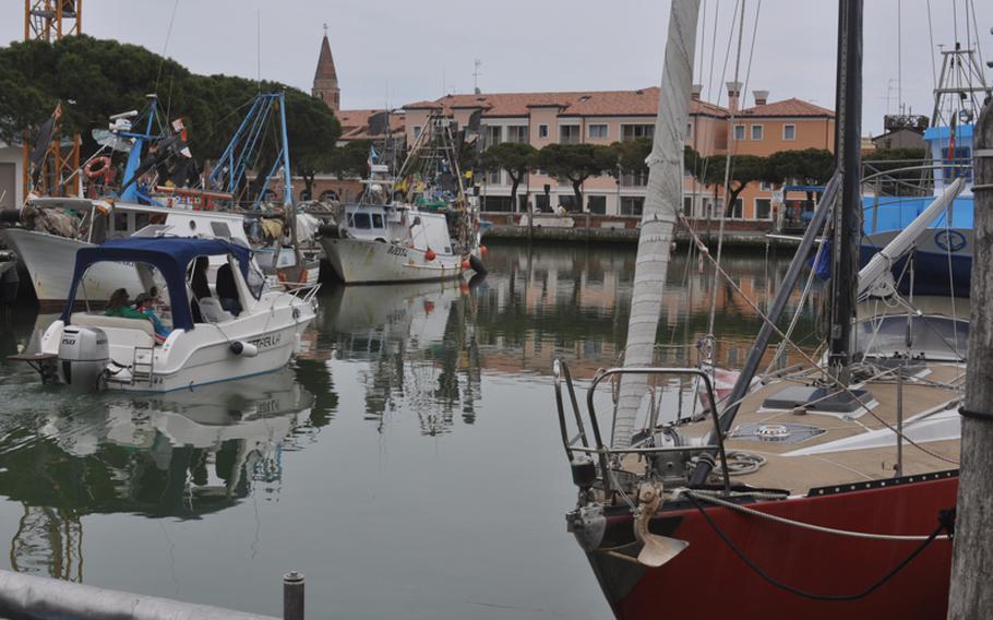 The port of Caorle, Italy, is one of the busiest between Venice and Trieste in terms of fishing boats and their daily hauls. But most tourists come for the beach.