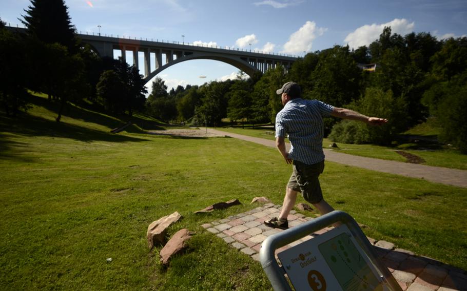 Matt Millham rips a backhand drive on hole 3 at the Dynamikum disc golf course in Pirmasens, Germany.
