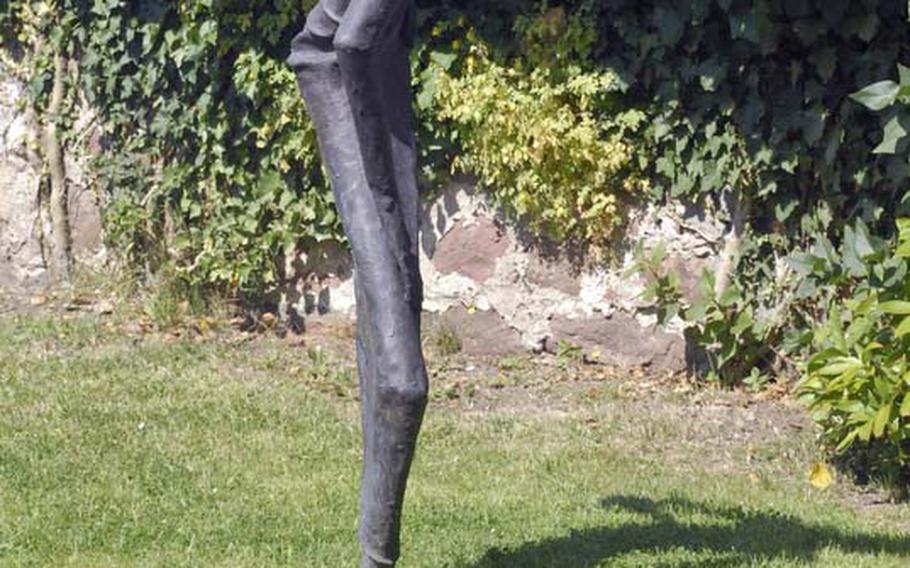 Sculptures depicting a scene from the fairy tale "The Frog Prince" decorate the yard at the Brüder Grimm-Haus in Steinau an der Strasse, Germany. In modern versions of the fairy tale, the frog's spell is broken by kissing him. In the original Brothers Grimm tale, the frog turns into a prince after he's thrown against the wall by a frustrated and angry princess.