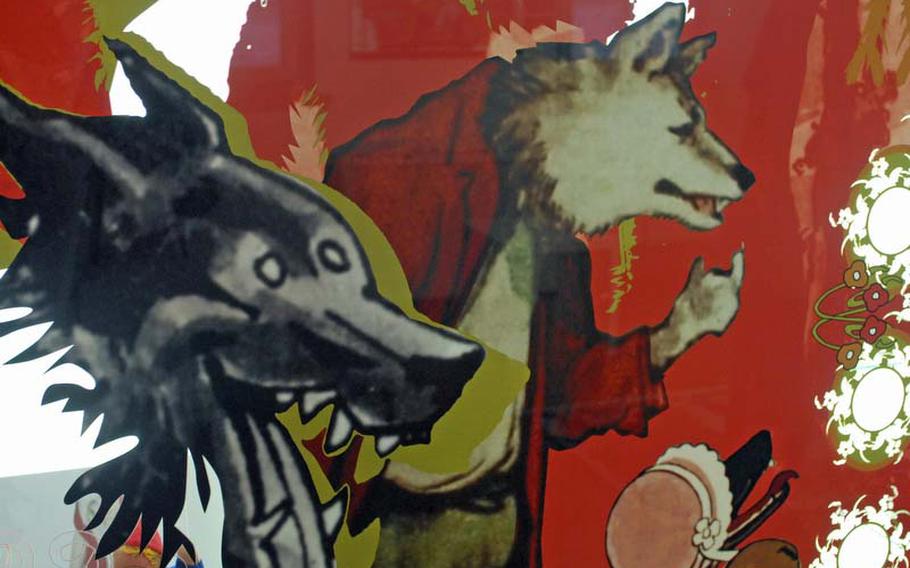 The wolf from "Little Red Riding Hood" is depicted in various forms on a wall at the  Brüder Grimm-Haus in Stein an der Strasse, Germany.