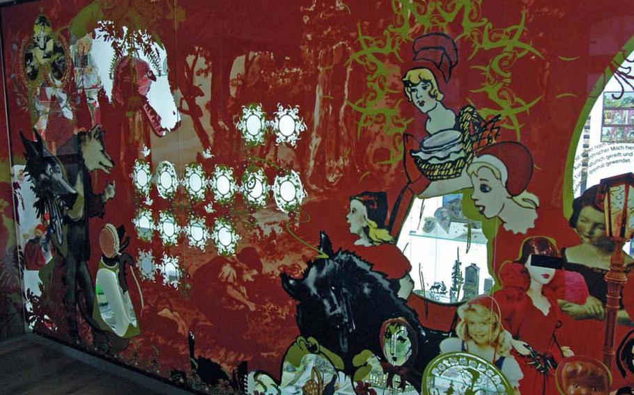 A "Little Red Riding Hood" display at the  Brüder Grimm-Haus in Steinau an der Strasse, Germany, reflects depictions of Little Red Riding Hood through the ages and from different cultures. Items such as dolls, dishes, mugs and toys demonstrate how deeply the fairy tale is immersed in modern culture.