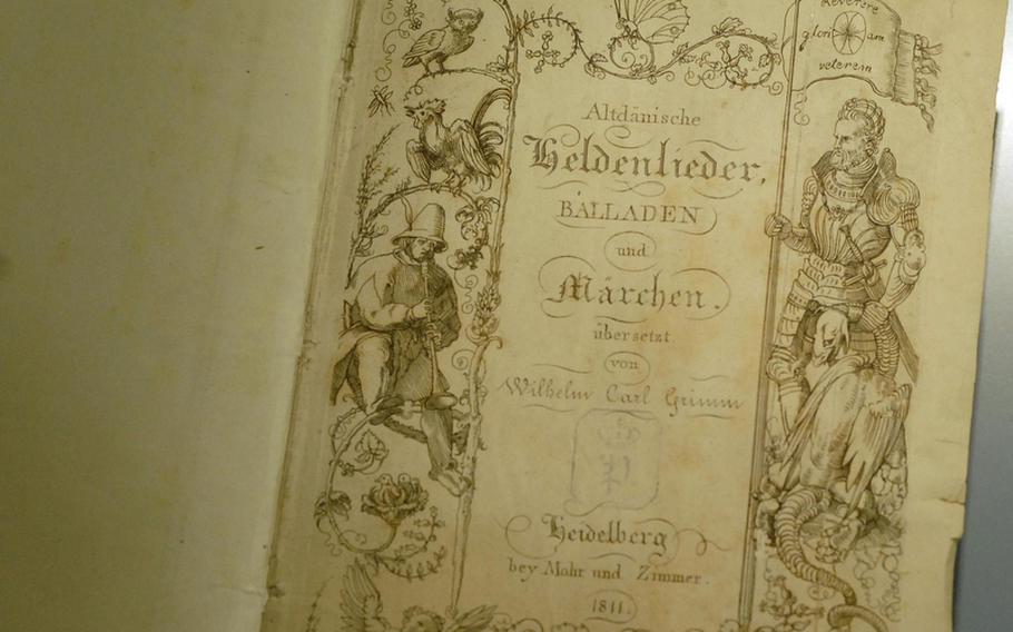 An 1811 book of hero songs, ballads and fairy tales translated from Danish by Wilhelm Grimm is one of many remarkably preserved publications on display at the  Grimm  house.