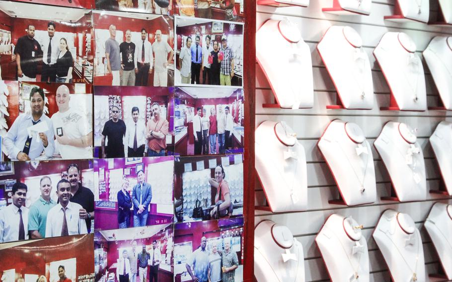 Many shop owners in the Manama Souq show their pride in doing business with U.S. personnel in Bahrain by displaying pictures and the business cards of previous American customers.