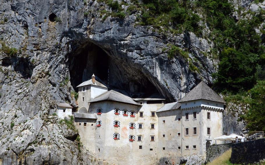 One of Slovenia's hidden treasures, Predjama Castle is tucked away in the mouth of a cave near the village of Predjama, Slovenia.