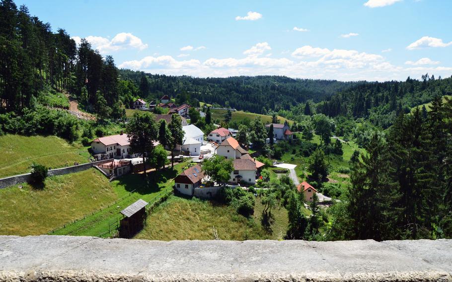 This picture offers a view of Predjama, Slovenia, from Predjama Castle's uppermost level, the terrace.