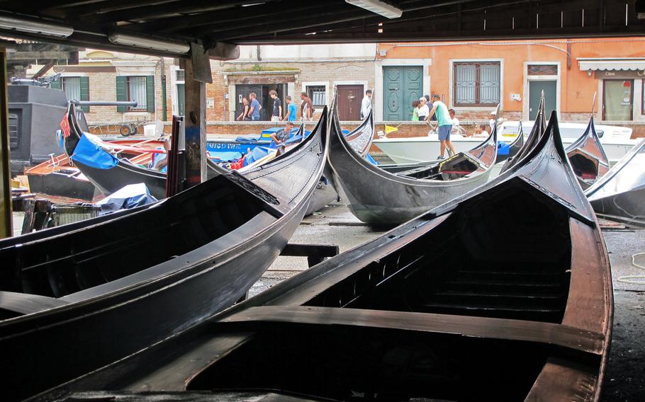 Centuries ago, some 1,500 gondolas plied the Venetian canals. Now there are only about 350, all of which cater to tourists. Here is one of few remaining gondola repair shops in San Trovaso Square.