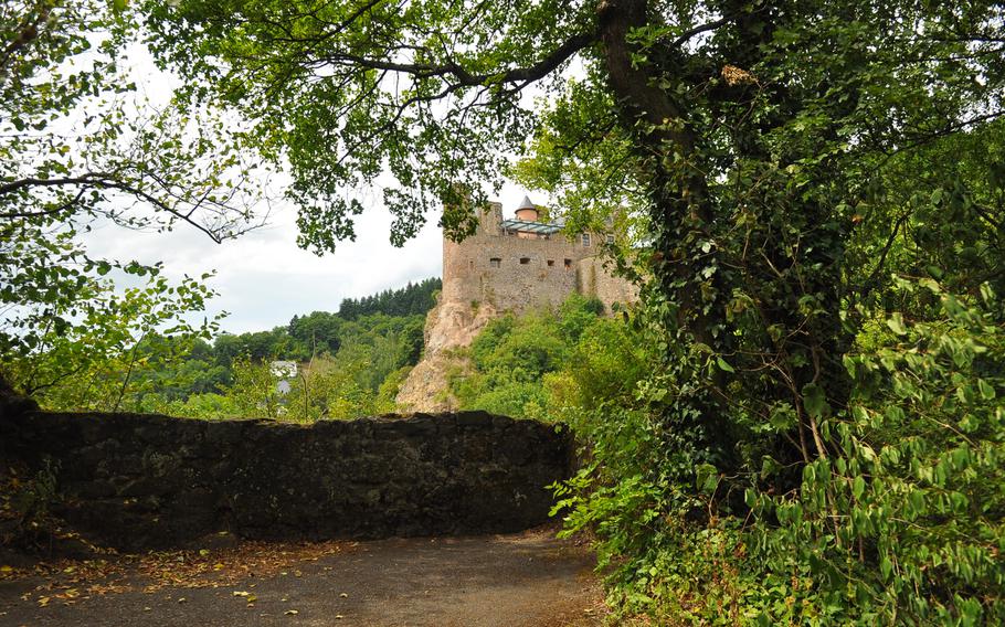 Oberstein Castle looms in the distance from a vantage point along the paved trail to the castle, in Idar-Oberstein, Germany.