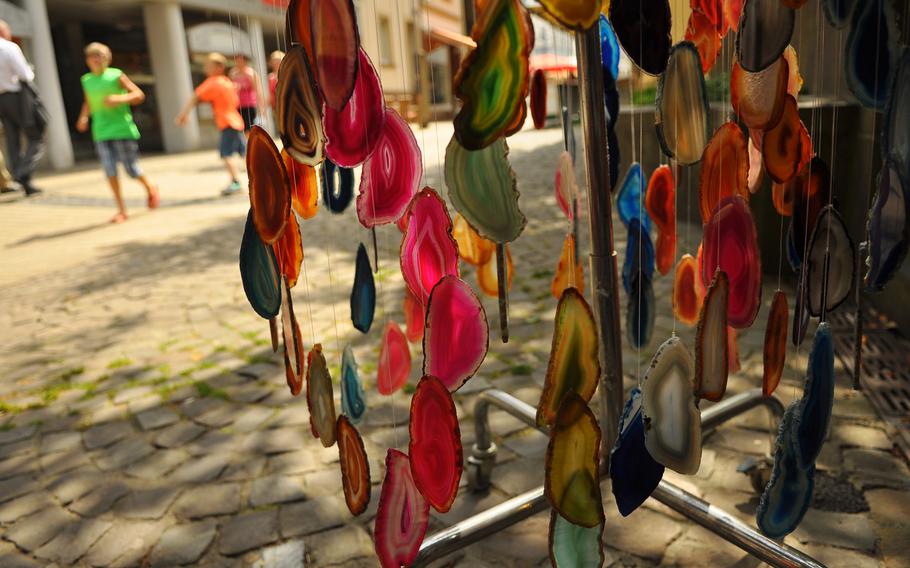 Thin slivers of polished-stone wind chimes add color to the pedestrian area of Idar-Oberstein, Germany.