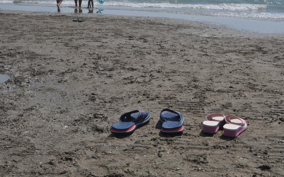 The owners of these sandals left on the beach in Lido have probably gone to take a dip. According to a local lifeguard, there isn't a dangerous undertow offshore, and the biggest danger is two varieties of jellyfish that are not generally considered deadly.