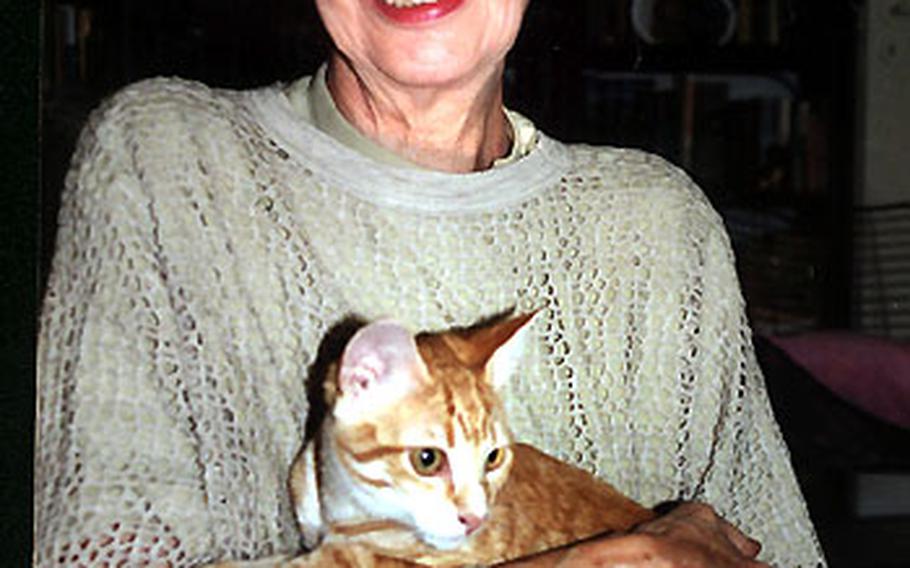 Sigrid Ruckaberle with a young cat that someone brought to her as a homeless kitten from Spain.