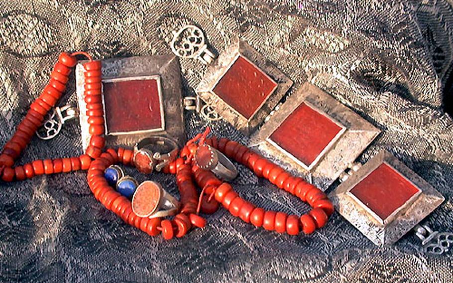 Jewelry is a popular souvenir for troops deployed to Afghanistan. Prices run the gamut, from $2 for small lapis stud earrings, to more than $100 for larger antique tribal pieces. The engraving on the red stones set into some of these rings and bracelets is an Islamic prayer to Allah.