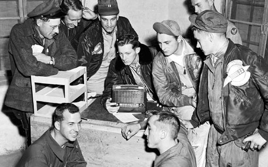 In Korea, F-86 Sabre pilots and other personnel of the 4th Fighter-Interceptor Wing listen to election returns over Armed Forces Radio Service in November 1952.