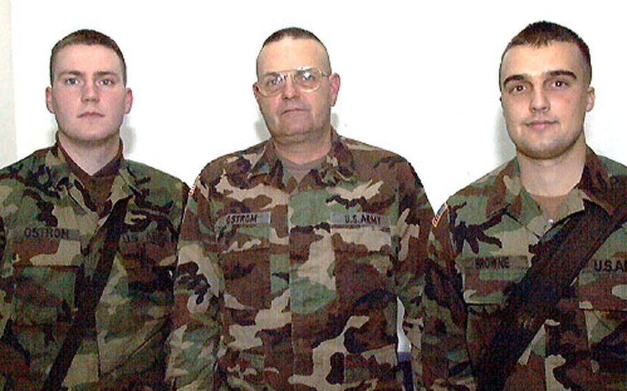 First Sgt. Scott Ostrom, his son Sgt. Ryan Ostrom, left, and stepson Spc. Wade Browne, right, all of 1st Battalion, 109th Infantry Regiment, are peacekeepers in Bosnia. Although in the same country, they do not get to spend much time together because they have heavy work schedules at different camps.