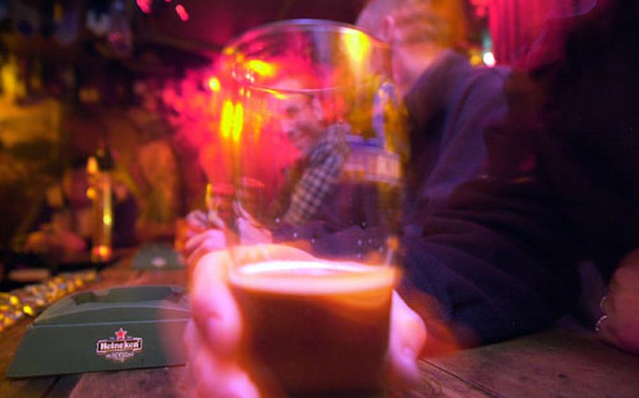 Servicemembers enjoy a round of drinks at a downtown Tokyo bar.