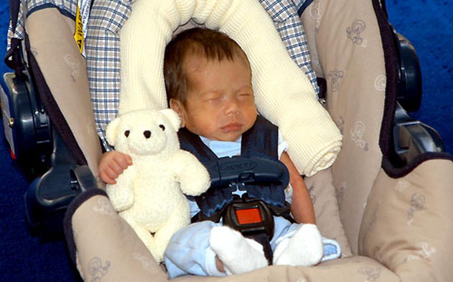 Evan Tattersall, though tiny in his car seat, is ready for his first ride home.
