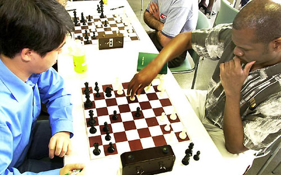 Dexter Thompson makes his move at the All Japan Golden Chess Tournament.