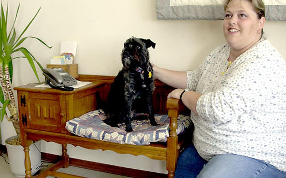 Tina Olson, a Baumholder sperrmüller, hit the jackpot recently when she found a German telephone table similar to this one. Olson donated the table to the base high school fund-raiser and it brought $575 at auction.
