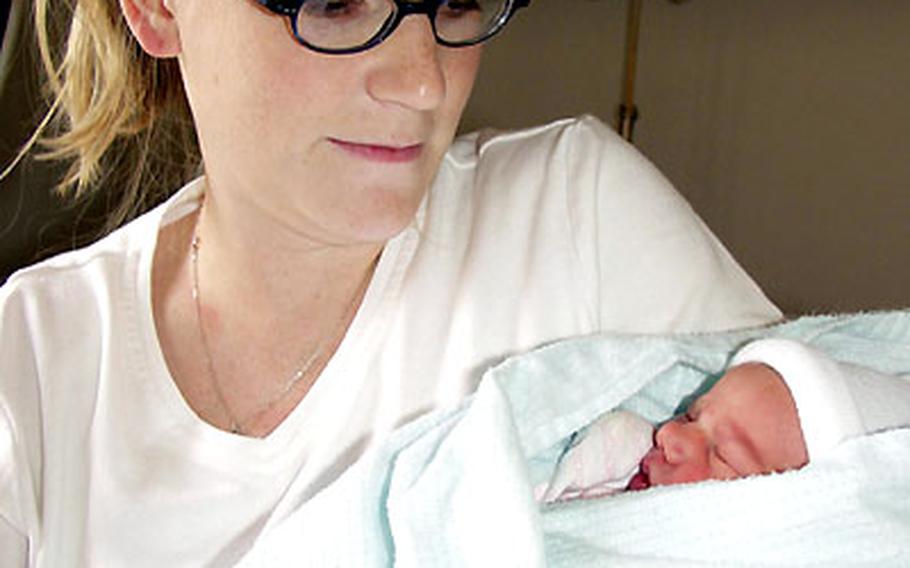 Shauna Lee Merritt holds her baby girl, Trista, on July 17 at Landstuhl Army Regional Medical Center, Germany. Trista was born July 15 at 5 pounds, 7 ounces, and 18.5 inches. Her father is Air Force Staff Sgt. Shawn Merritt, a jet engine mechanic with the 723rd Air Mobility Command at Ramstein Air Force Base. The Merritts chose to have their baby at a U.S. military medical facility, but European hospitals have many of the same services and procedures for expectant mothers.