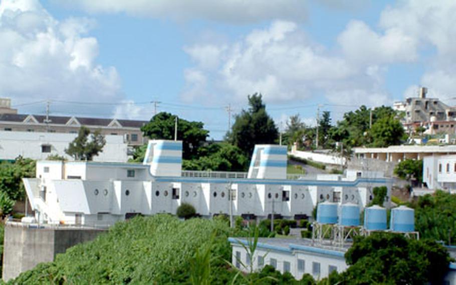 The Queen Elizabet, a grounded Love Boat, sits atop Okinawa City’s “Love Hotel Valley.”