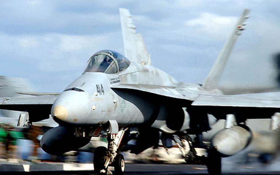 An F/A-18C “Hornet” with Carrier Air Wing Five’s “Dambusters” launches from the USS Kitty Hawk flight deck. The Dambusters recently trained in the Strike Fighter Advanced Readiness Program on Guam.