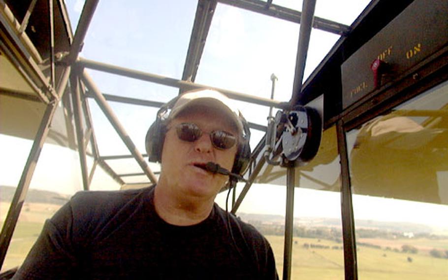 With the German countryside seemingly rising up to meet man and machine, Steven Whelan prepares to land his vintage World War II artillery observation plane on a grassy runway north of Frankfurt.