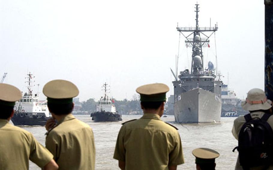 The USS Vandegrift arrives in Ho Chi Minh City, Vietnam, for a scheduled port visit, the first by a U.S. Navy ship to Vietnam in 30 years.