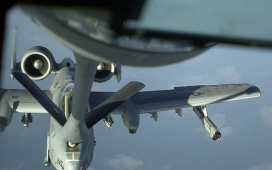 An A-10 Thunderbolt takes on fuel from a KC-135 Stratotanker while flying over the ocean off the west coast of South Korea Thursday.