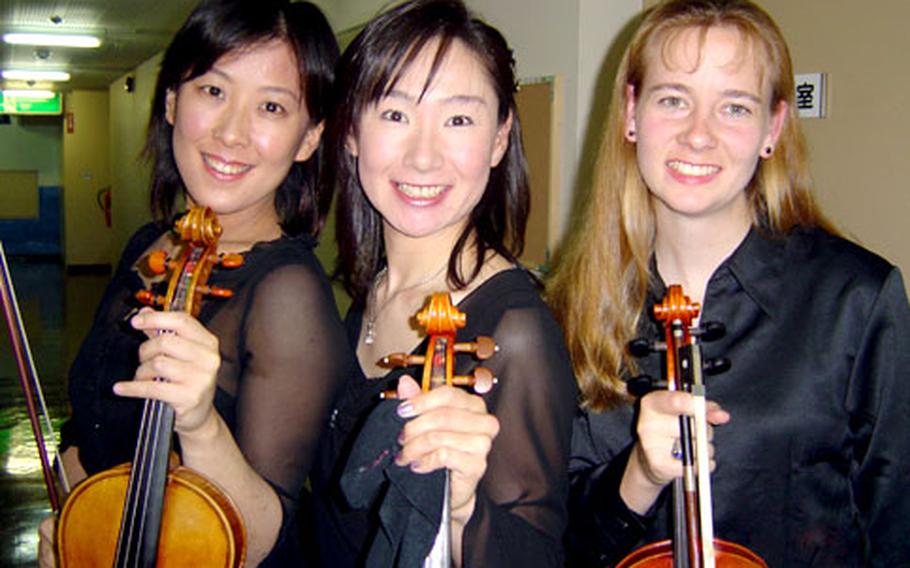 First Lt. Brooke Page has been able to pursue her love of music and make many Japanese friends as the only foreigner in the Hamura Philharmonic Orchestra, a group of amateur musicians from communities near Yokota Air Base, Japan.