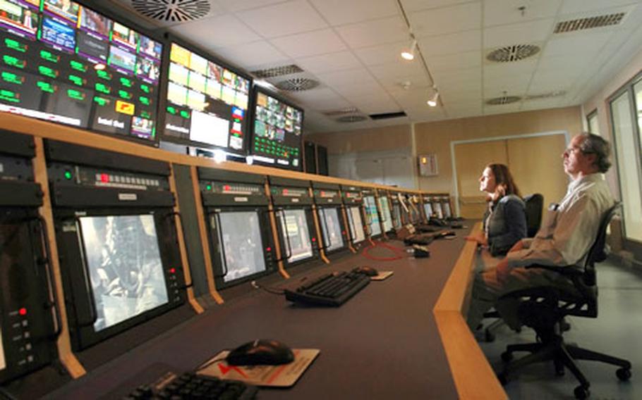 Network Operations Controllers Marla Bogaerts, left, and John Morlock monitor AFN&#39;s 14 radio and 10 television channels for any signs of trouble from the 24-hour Network Operations Center at AFN-Europe&#39;s new headquarters in Mannheim.