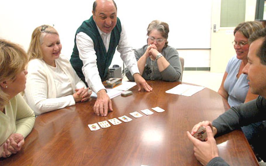 Giuseppe del Giacco teaches Americans how to play the popular Italian card game Scopa, which means “broom” or “sweep.” Del Giacco, 52, is the intercultural relations specialist at the Fleet and Family Support Center at the Navy base at Gricignano in Naples, Italy.