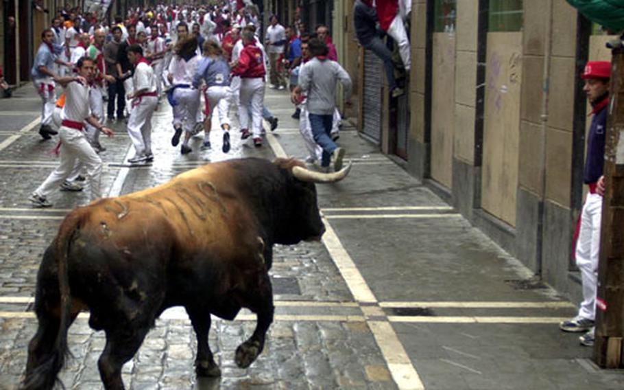 The Running of the Bulls in Pamplona is best watched from a safe distance. It&#39;s one of the most popular tourist events in Spain.