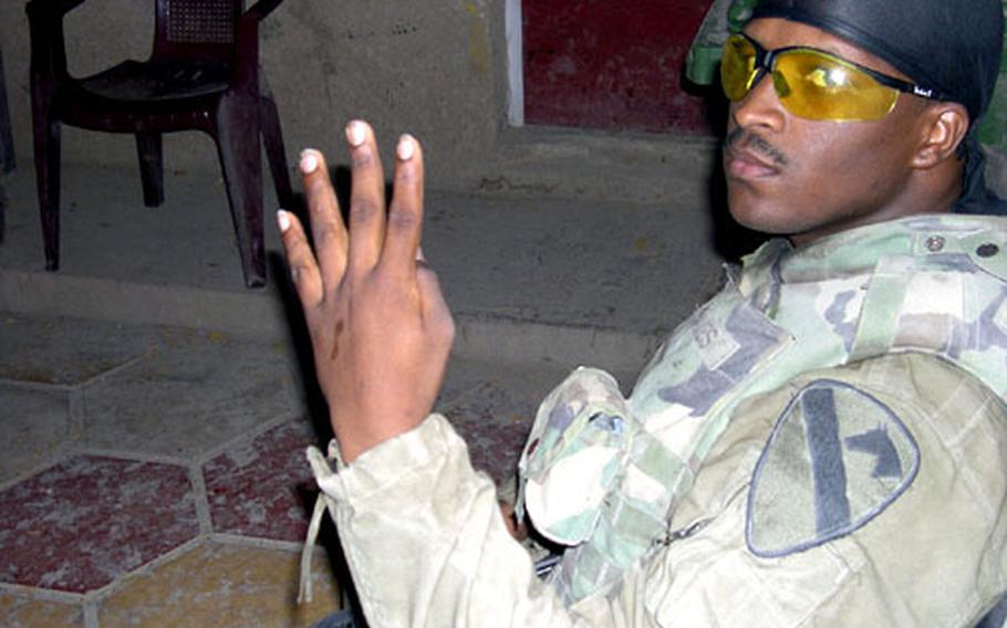 Staff Sgt. Terrance Staves takes a break from working on the album outside his barracks in Baghdad. Staves says reaction to the album, which has sold about 1,000 copies, has been positive.