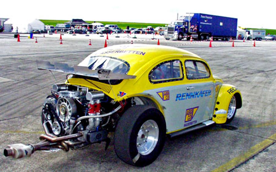 European-made cars, like this souped-up Volkswagen, participated in the drag race at Bitburg, but the real stars of the show were the American-made models.