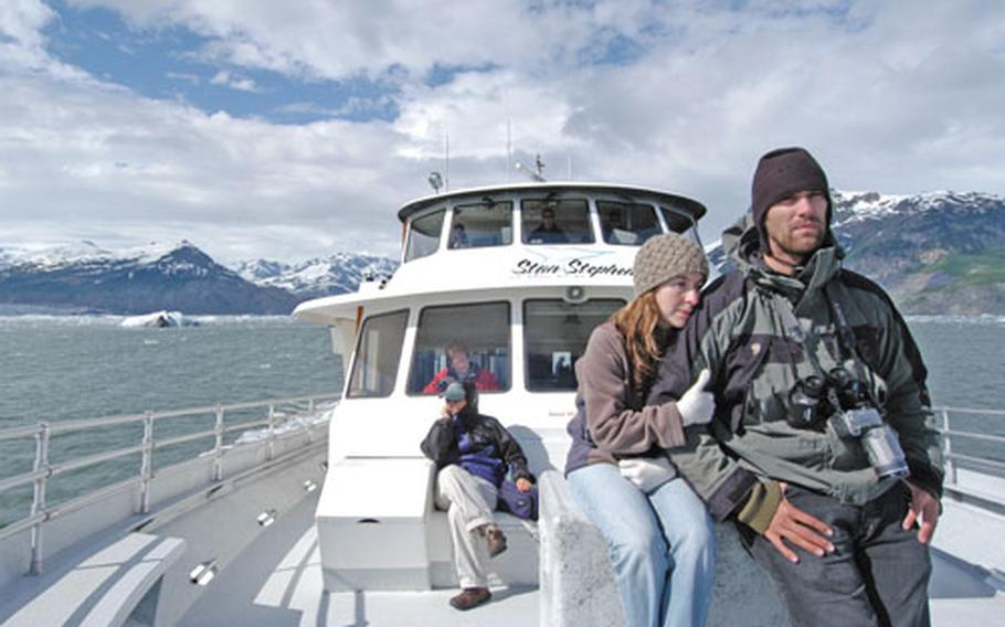 On the deck of the Glacier Spirit as it makes its way through Prince William sound, a couple finds the glacial chill a good incentive for huddling close.