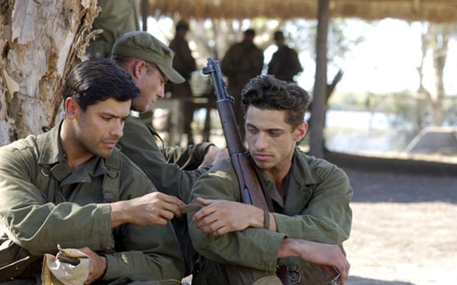 From left, Mark Consuelos and James Carpinello star in “The Great Raid.” The director wanted his actors to bring realism to their roles — so he made them attend makeshift boot camp for two weeks before filming.
