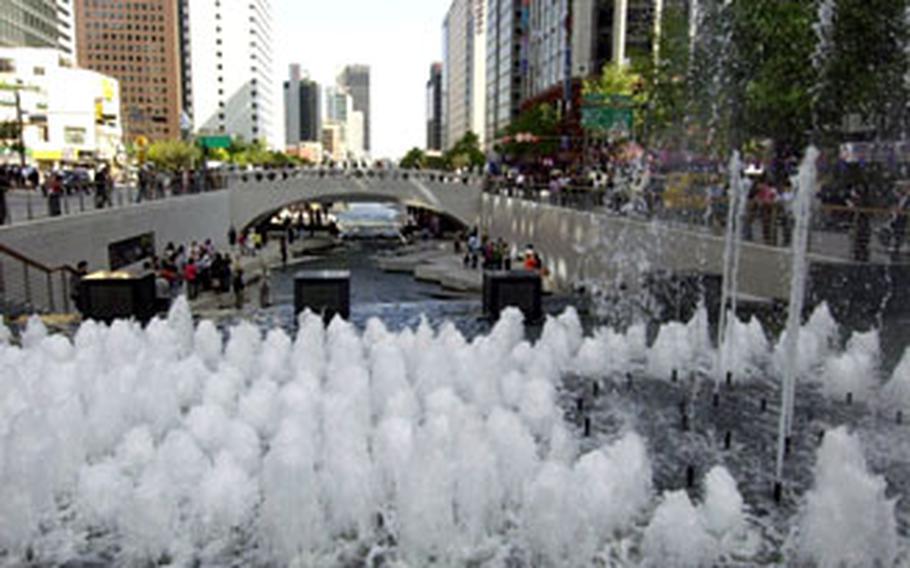 The recently opened Cheonggye Stream cuts through downtown Seoul. The stream recently reopened after a two-year restoration project.